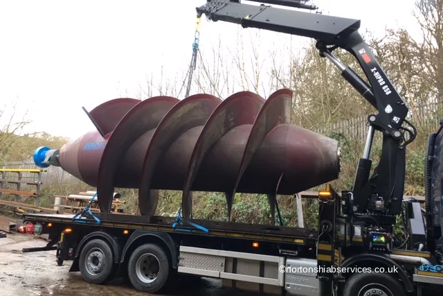 An Archimedes screw water turbine loaded on a Nortons hiab lorry