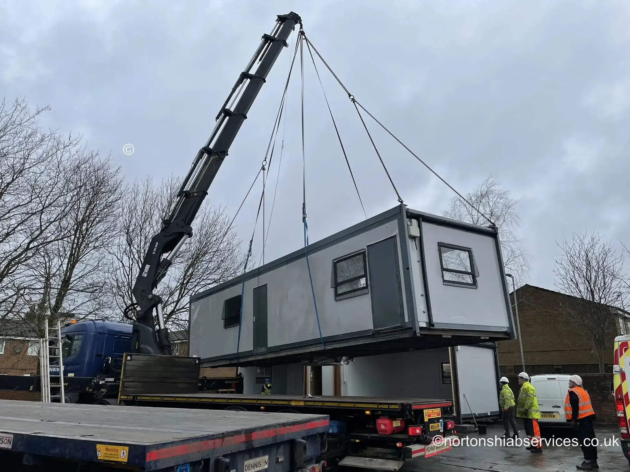 Nortons hiab craning a modular classroom building into place at a Manchester school