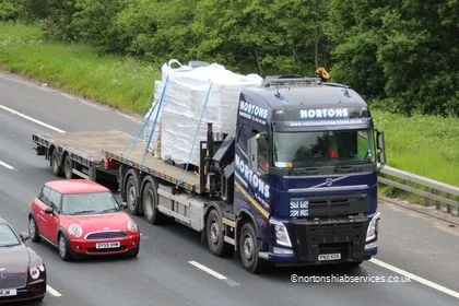 A Nortons hiab lorry carrying wrapped electrical panels on the M6 at Lymm