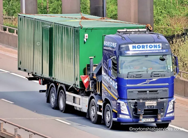 Nortons hiab lorry carrying a container southbound on the M6