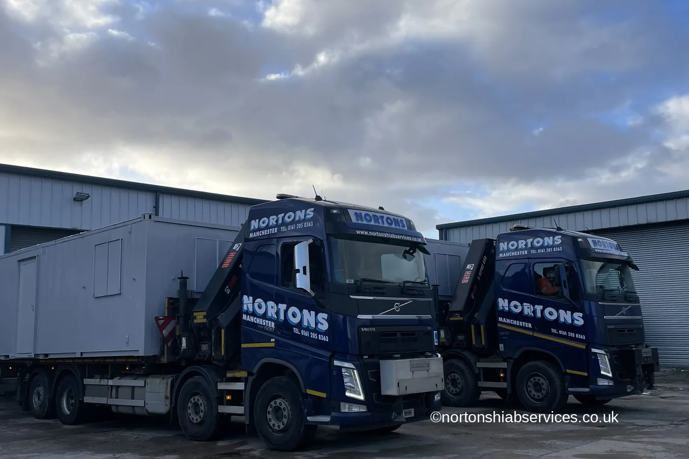 Refurbished portable cabins loaded on Nortons hiab lorries ready for delivery