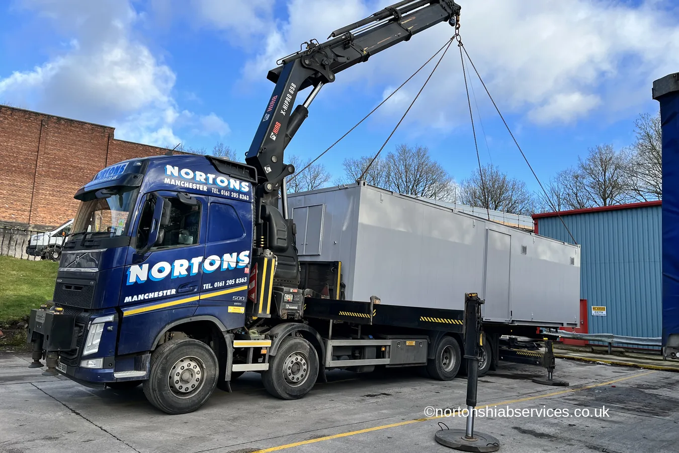 A Nortons hiab delivering a refurbished cabin set up at Romiley Board Mill