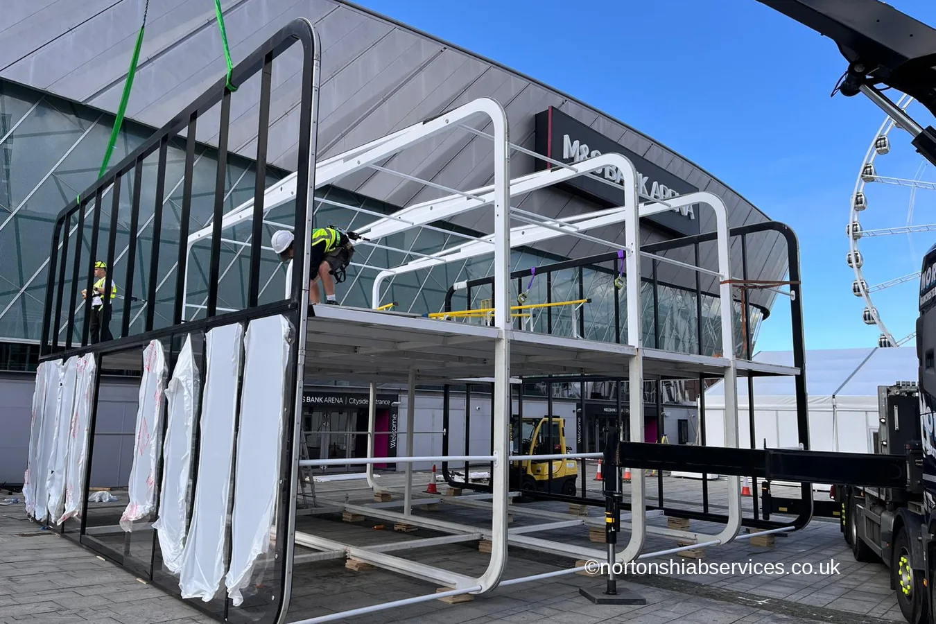 A large events marquee frame being assembled outside an arena in Liverpool