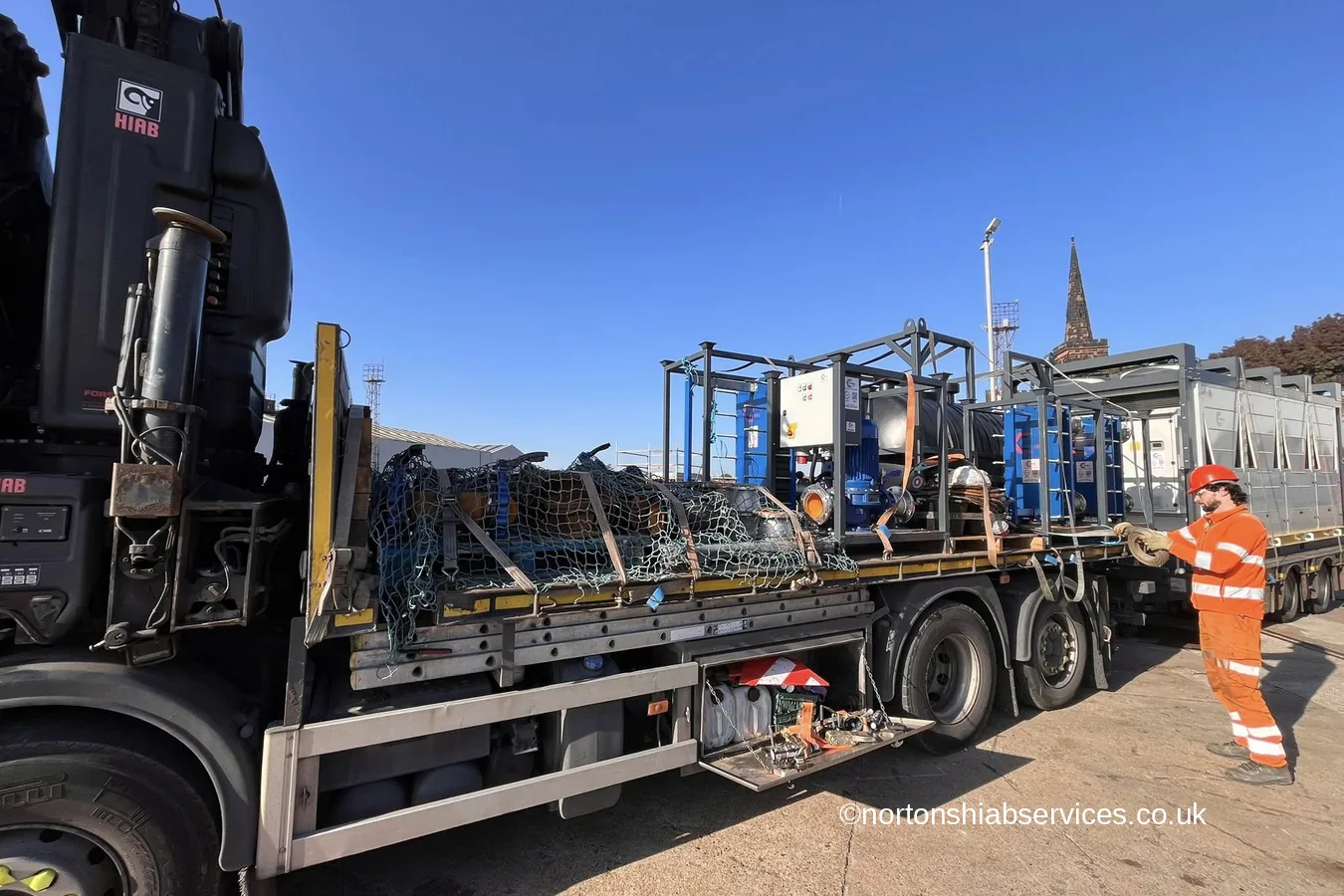 A Nortons flatbed loaded with plant and pipework at Birkenhead