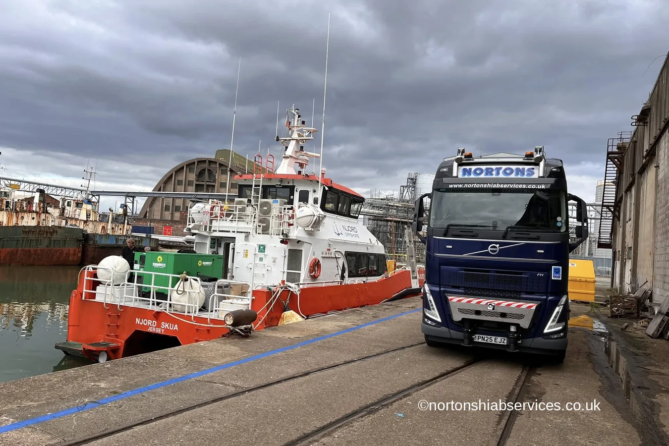 A Nortons hiab lorry alongside a vessel at Huskisson Dock in Liverpool