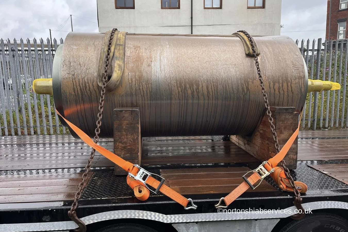 A large steel pressure vessel strapped down on a Nortons flatbed in Liverpool