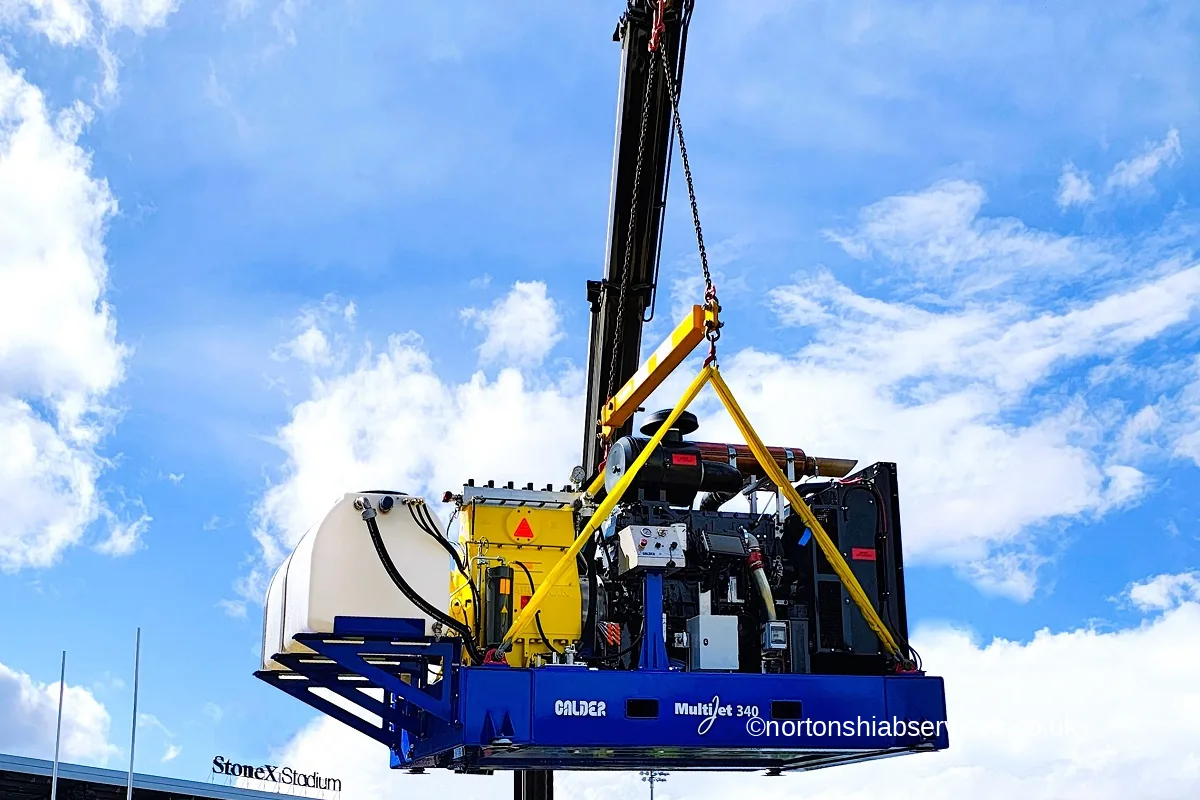 A packaged pump skid lifted on slings at StoneX Stadium in London