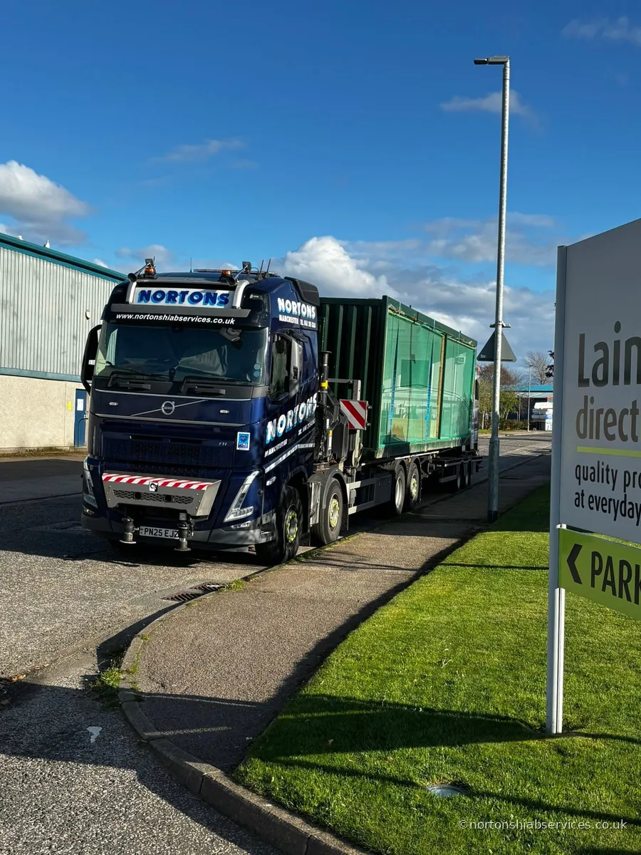 A Nortons artic loaded with a green container on a delivery at Inverurie in Aberdeenshire