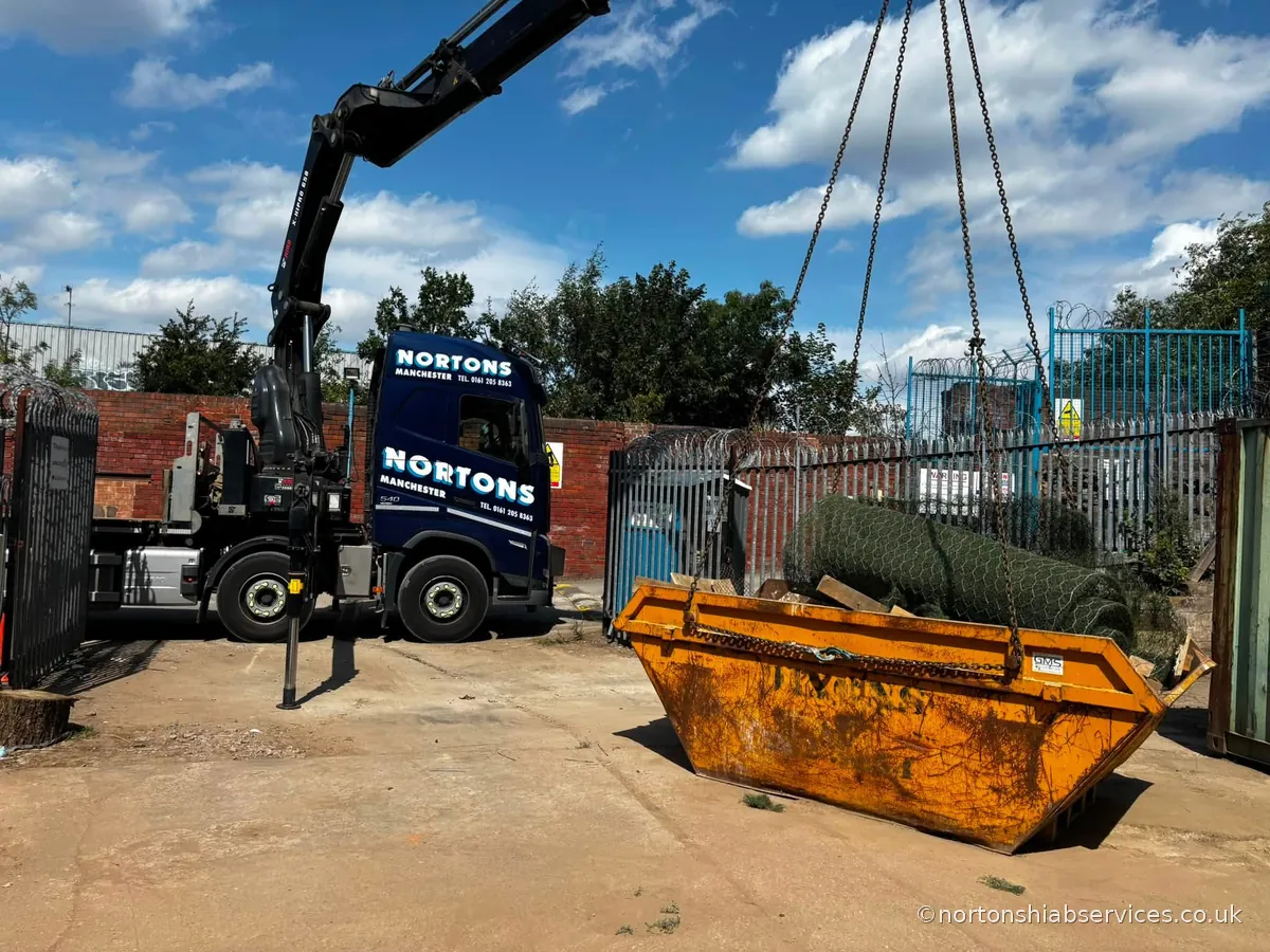 A Nortons hiab lorry working with the boom extended on a yard in Sheffield