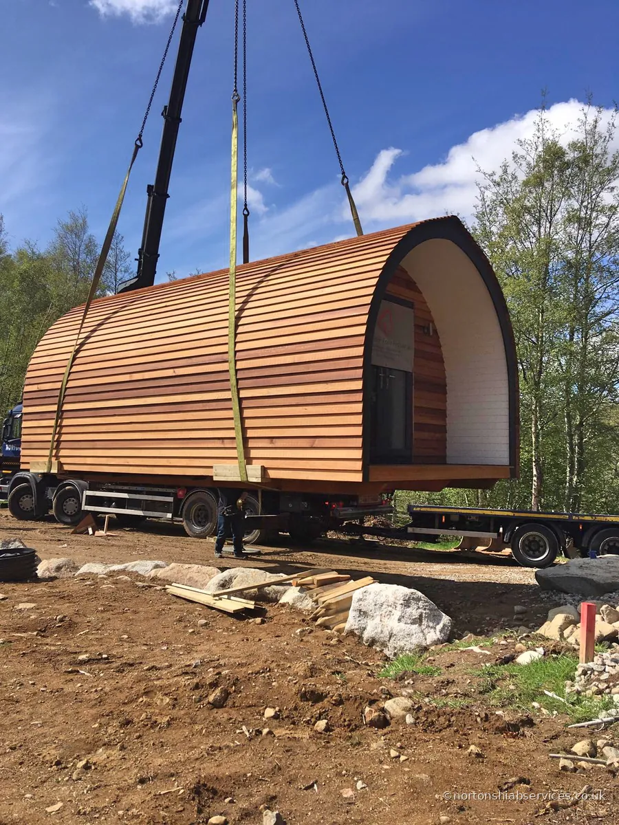 Close view of a glamping pod under a Nortons crane hook
