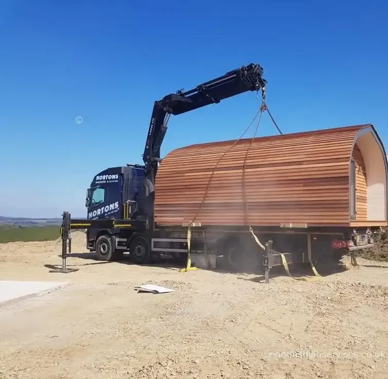 Two glamping pods loaded on a Nortons wagon and drag