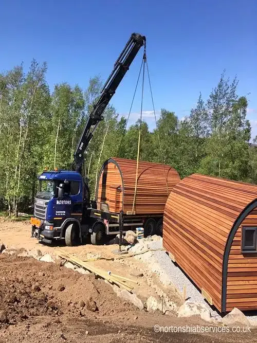 Glamping pod being lowered onto prepared ground
