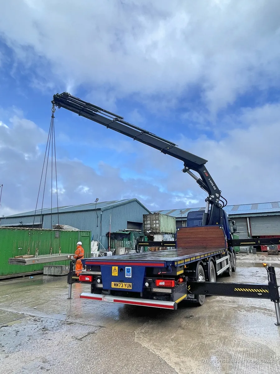 Precast concrete unit suspended from a Nortons hiab crane