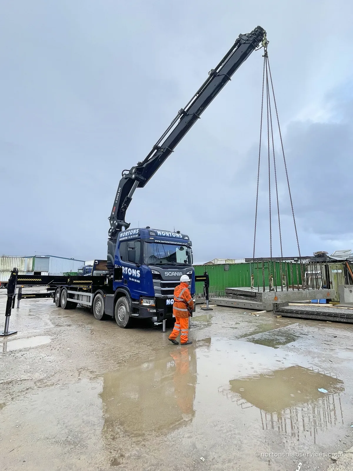 Precast concrete unit lifted off a Nortons trailer