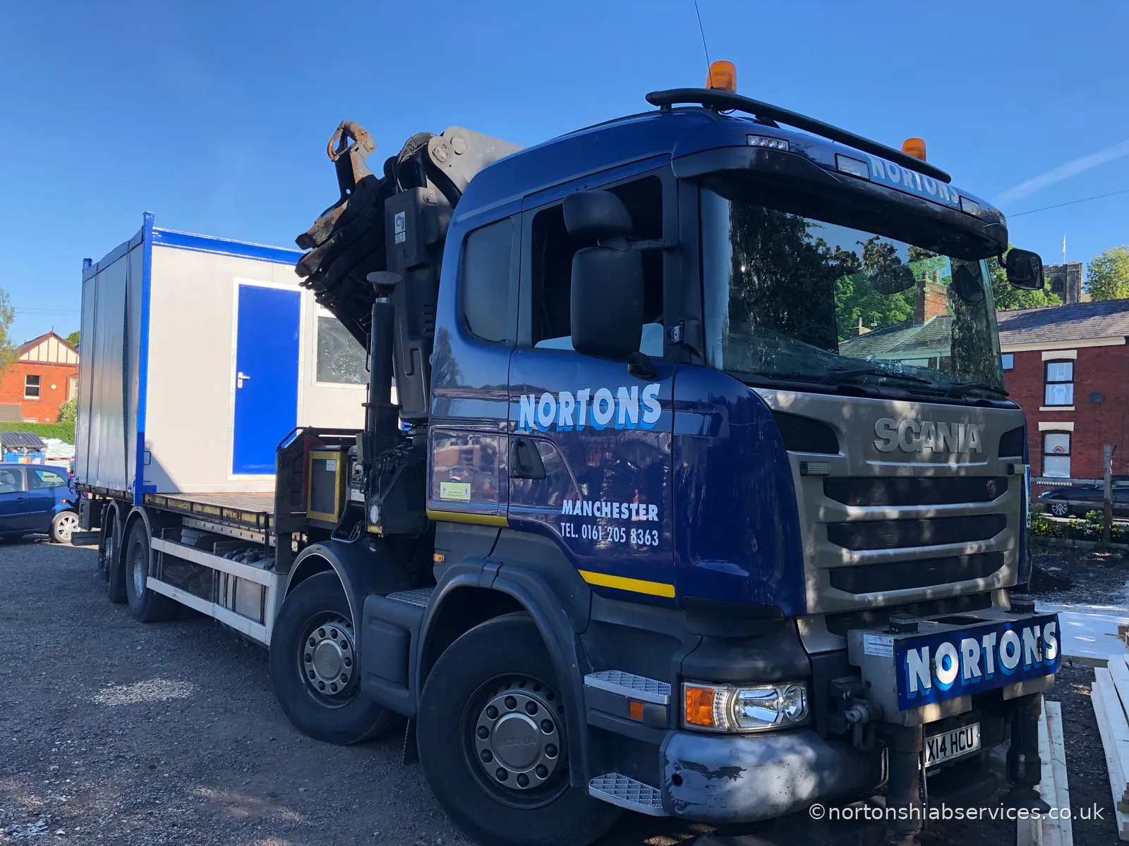 A portable cabin sold and delivered by Nortons, set down on site