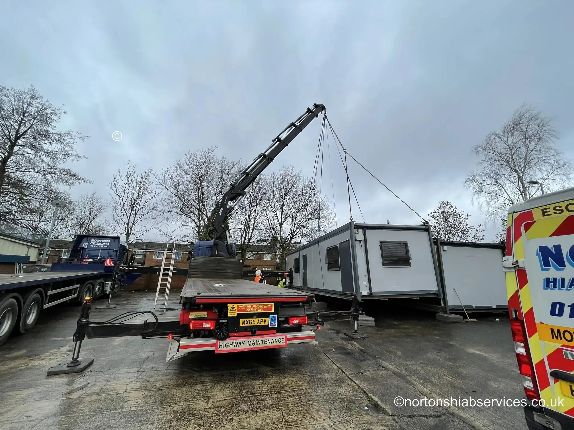 A modular classroom building being craned into place at a Manchester school
