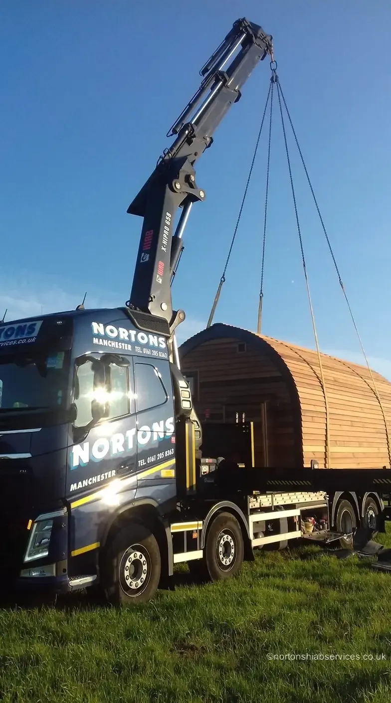 Glamping pods loaded on a Nortons trailer for delivery