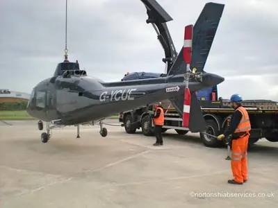 Nortons lorries beside the hangar during the helicopter movement at Blackpool Airport