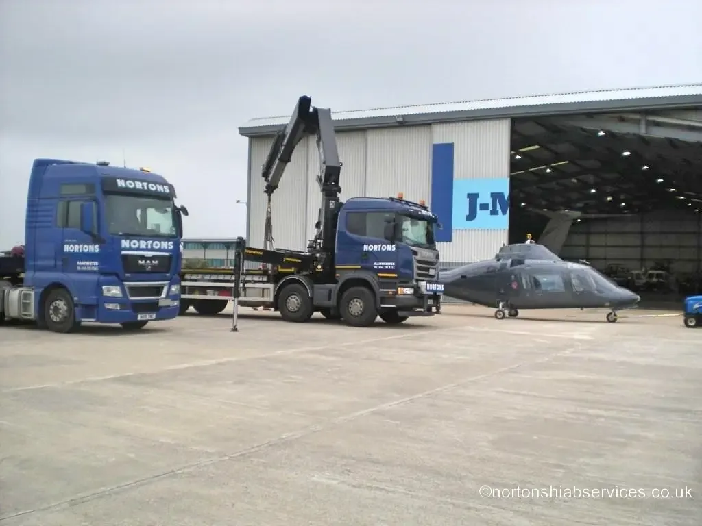 Helicopter prepared for road transport by Nortons at Blackpool Airport