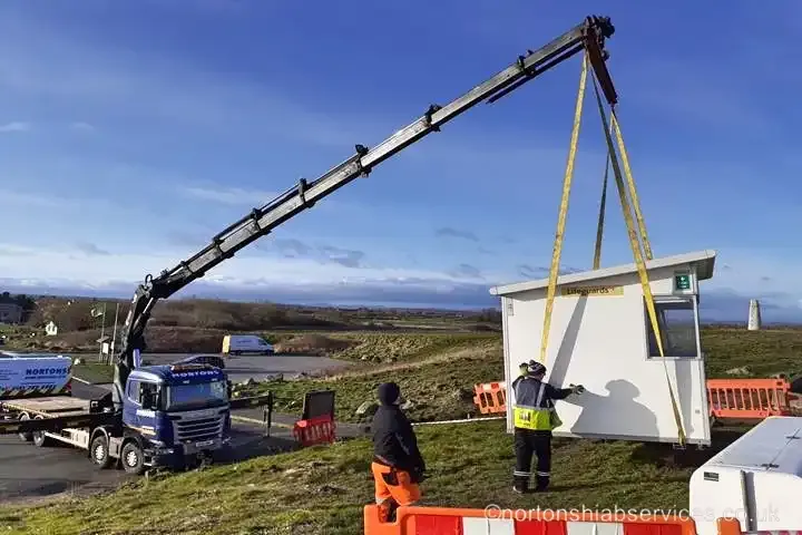 Nortons hiab placing a kiosk on a coastal site