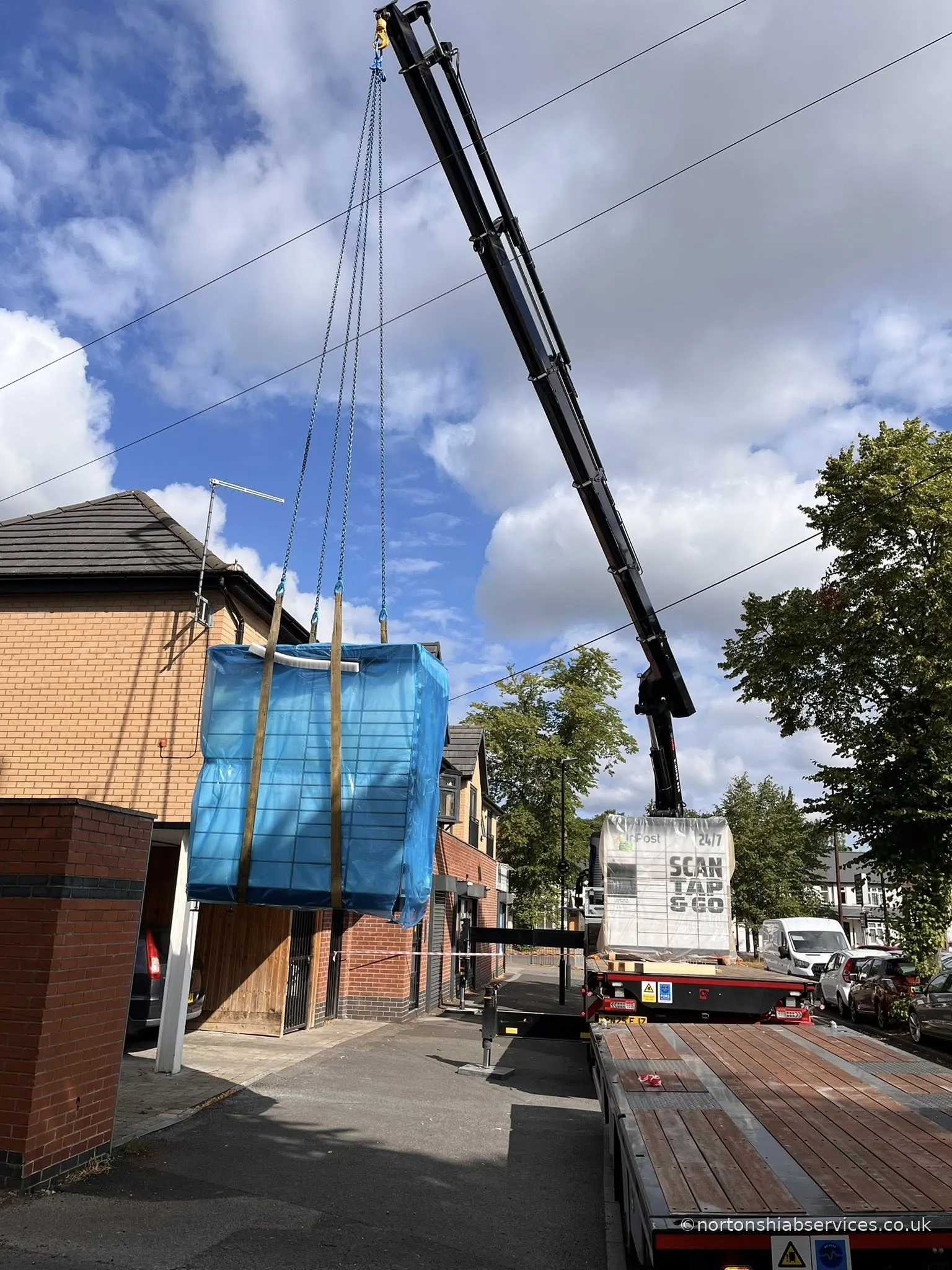 Nortons hiab boom extended over a Birmingham street