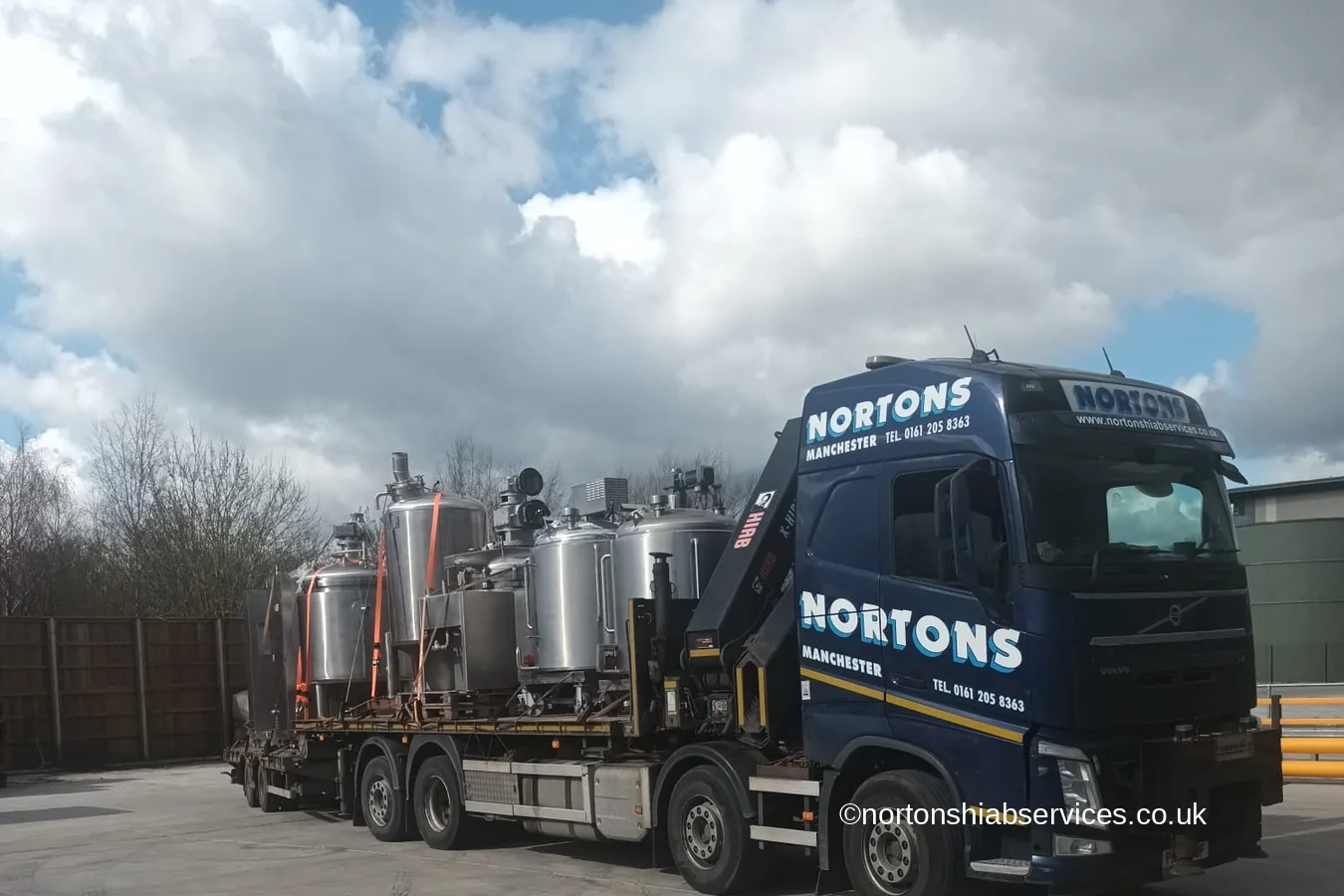 A Nortons crane lorry loaded with stainless steel process vessels