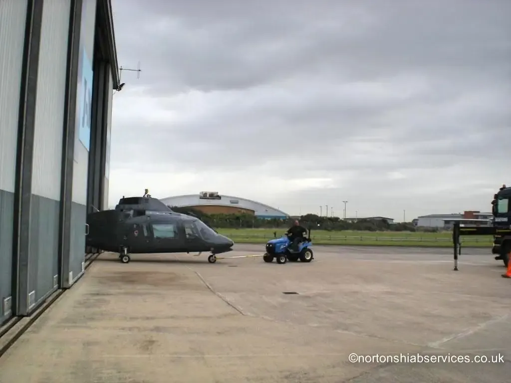 Nortons hiab positioned alongside a helicopter at Blackpool Airport