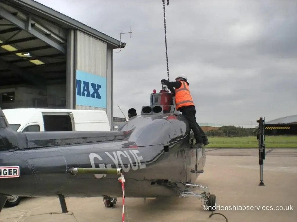 Operative securing a helicopter airframe under a Nortons crane