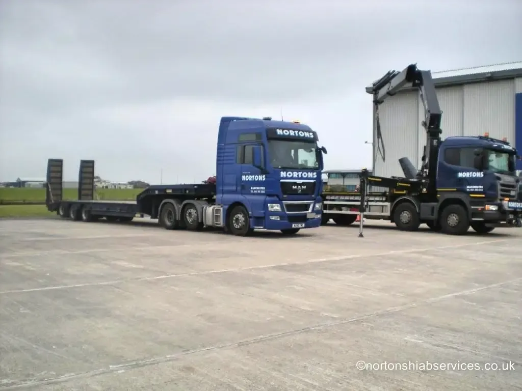 Nortons vehicles positioned to load an aircraft onto a trailer