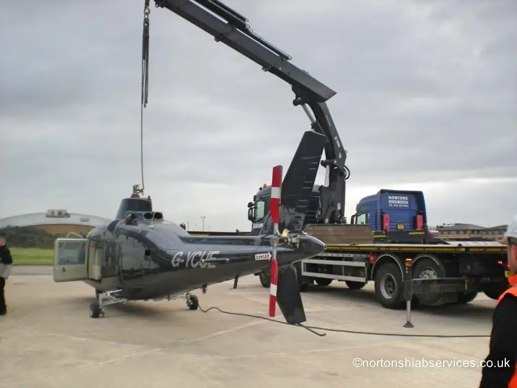 Helicopter loaded and ready to move on a Nortons vehicle