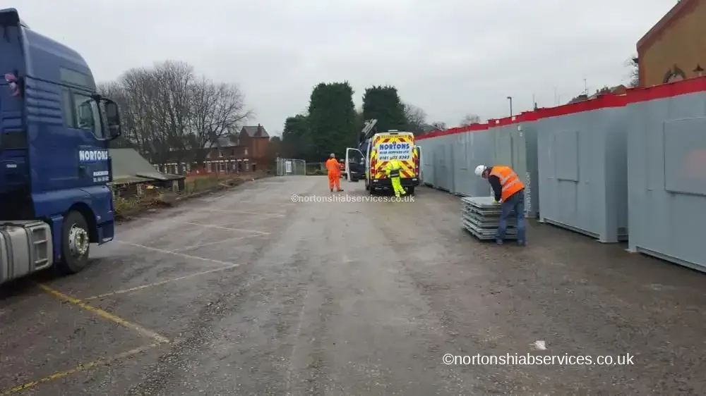 Nortons tractor unit alongside a completed cabin compound in Derby