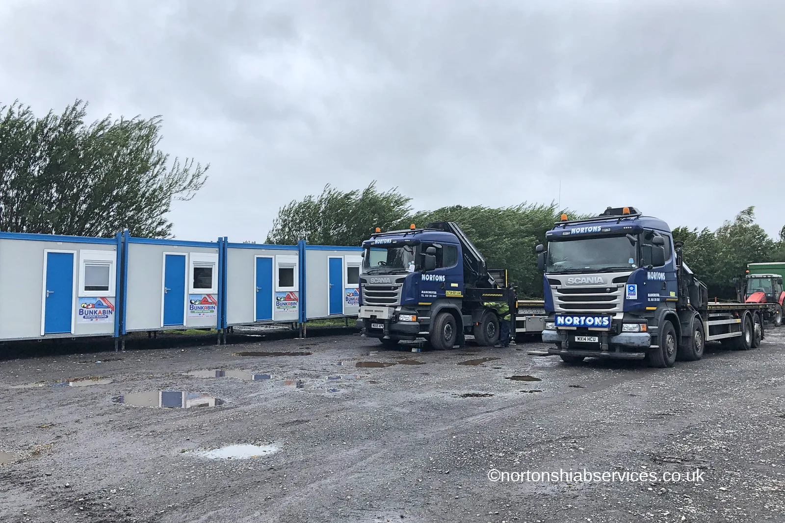 A row of blue and white accommodation cabins delivered by Nortons on hard standing at Hesketh Bank in west Lancashire