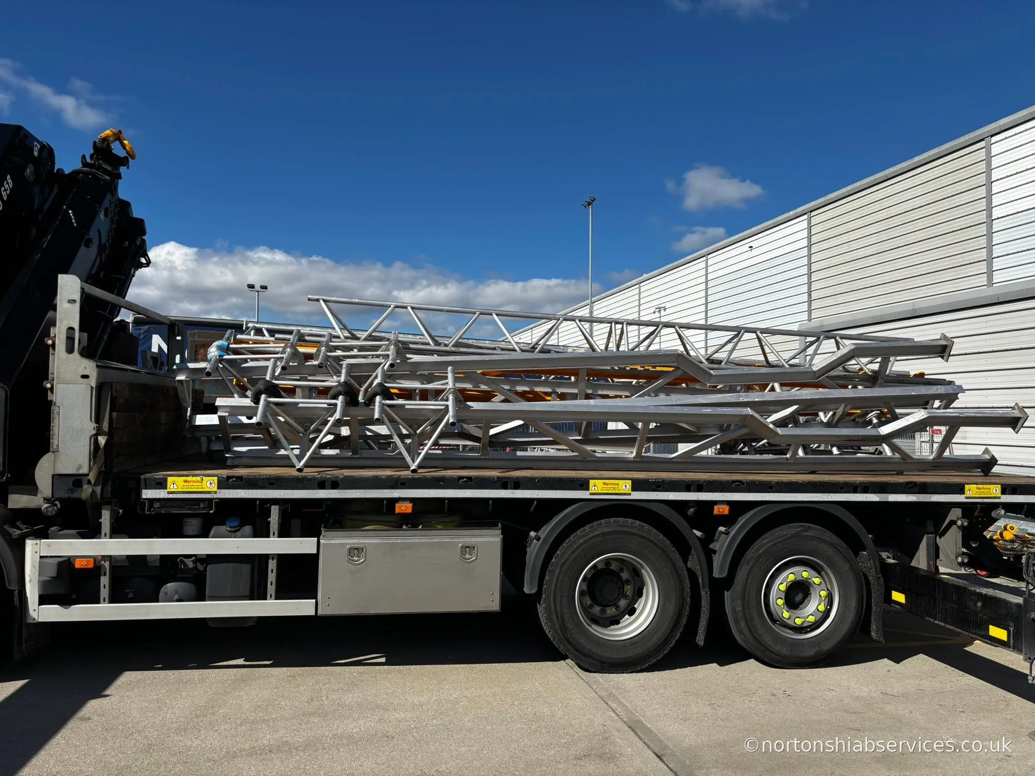 Nortons hiab lorry loaded with a large steel truss in Liverpool