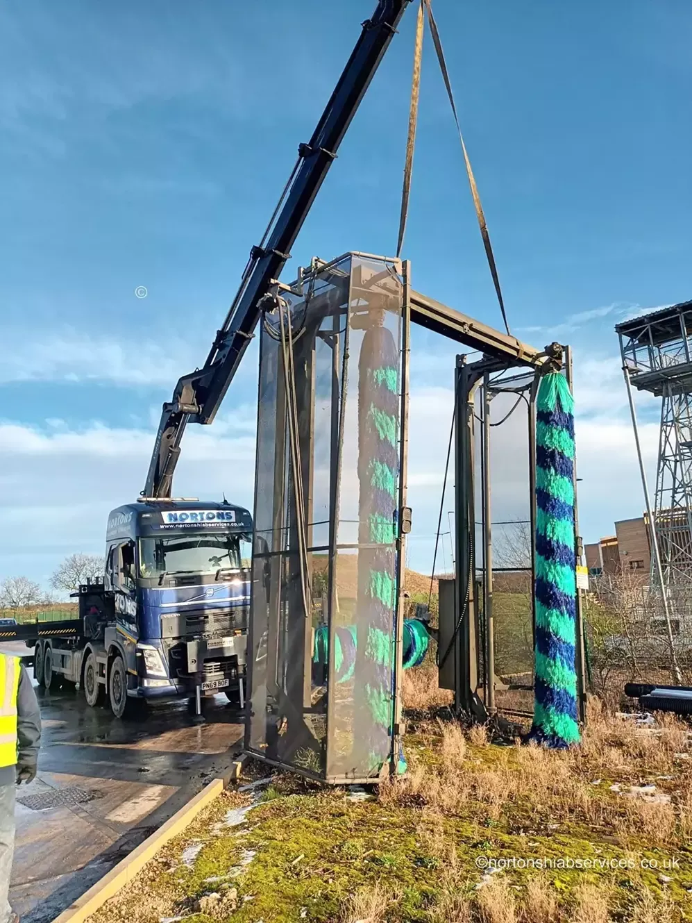 Nortons eight-wheel rigid hiab lifting a vehicle wash gantry into place