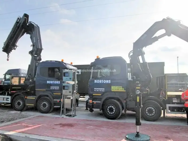 Two Nortons eight-wheel rigid hiabs set up on the same site with their stabilisers down
