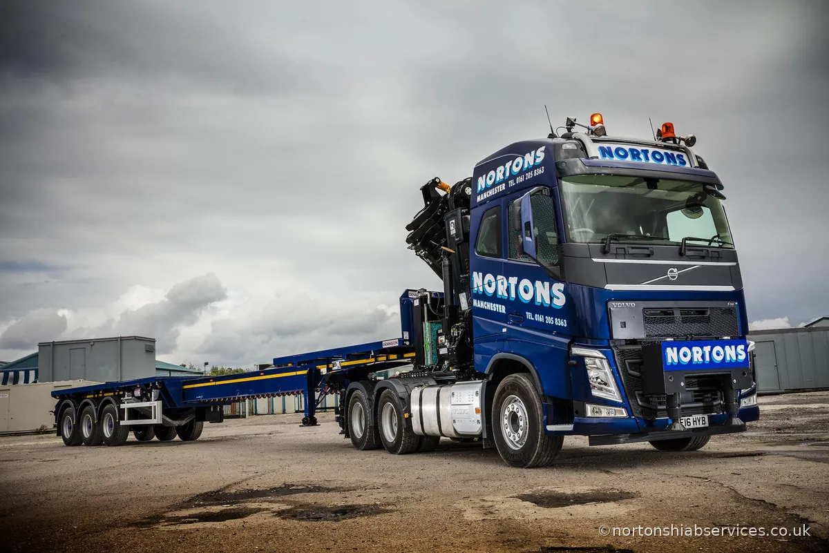 Rear view of a Nortons Volvo 622 hiab artic loaded for the road