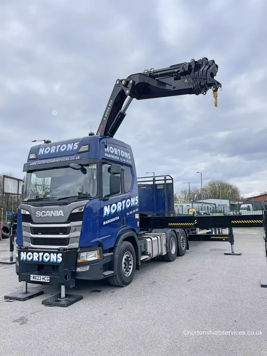 Nortons 658 artic hiab with the boom raised on a site