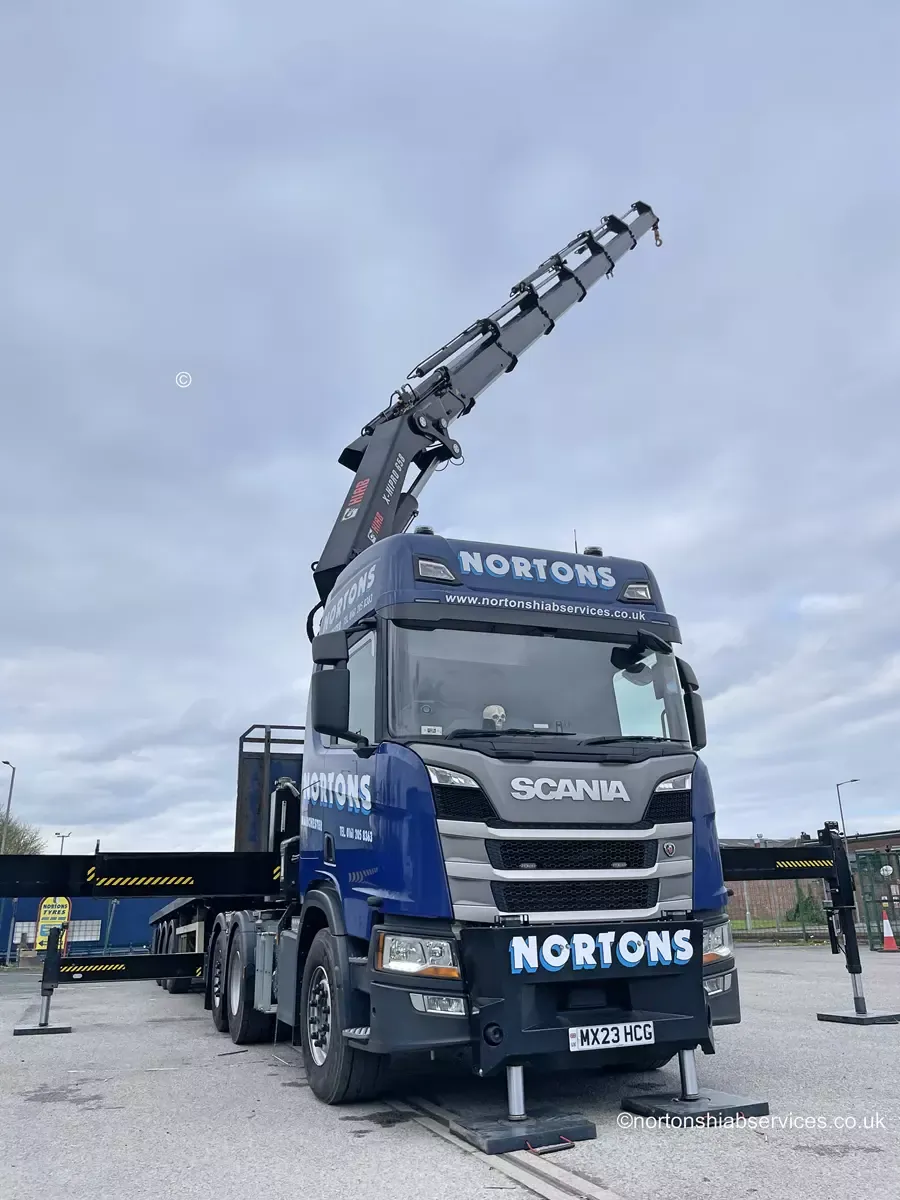 Side view of a Nortons 658 artic hiab loaded and ready to travel