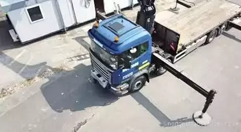 Overhead view of a Nortons 855 hiab lifting panels on a site