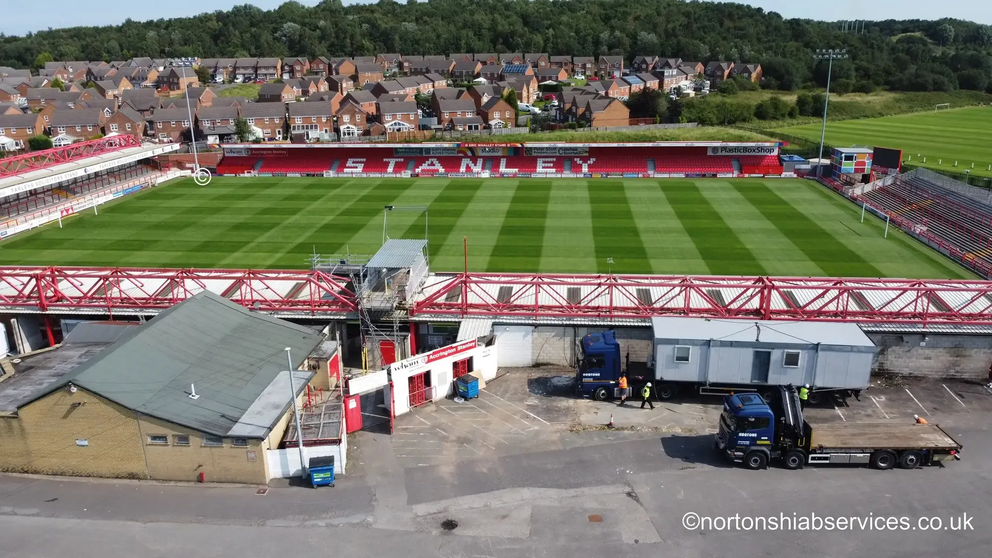 Nortons 855 hiab delivering a portable unit inside a football stadium