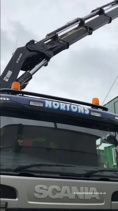Front of a Nortons Scania with the loader crane folded down over the cab