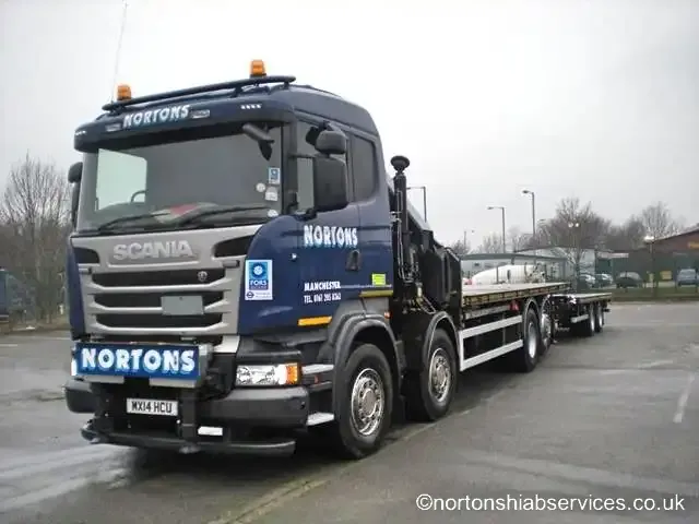 Nortons wagon and drag hiab out on the road with the drag trailer coupled behind