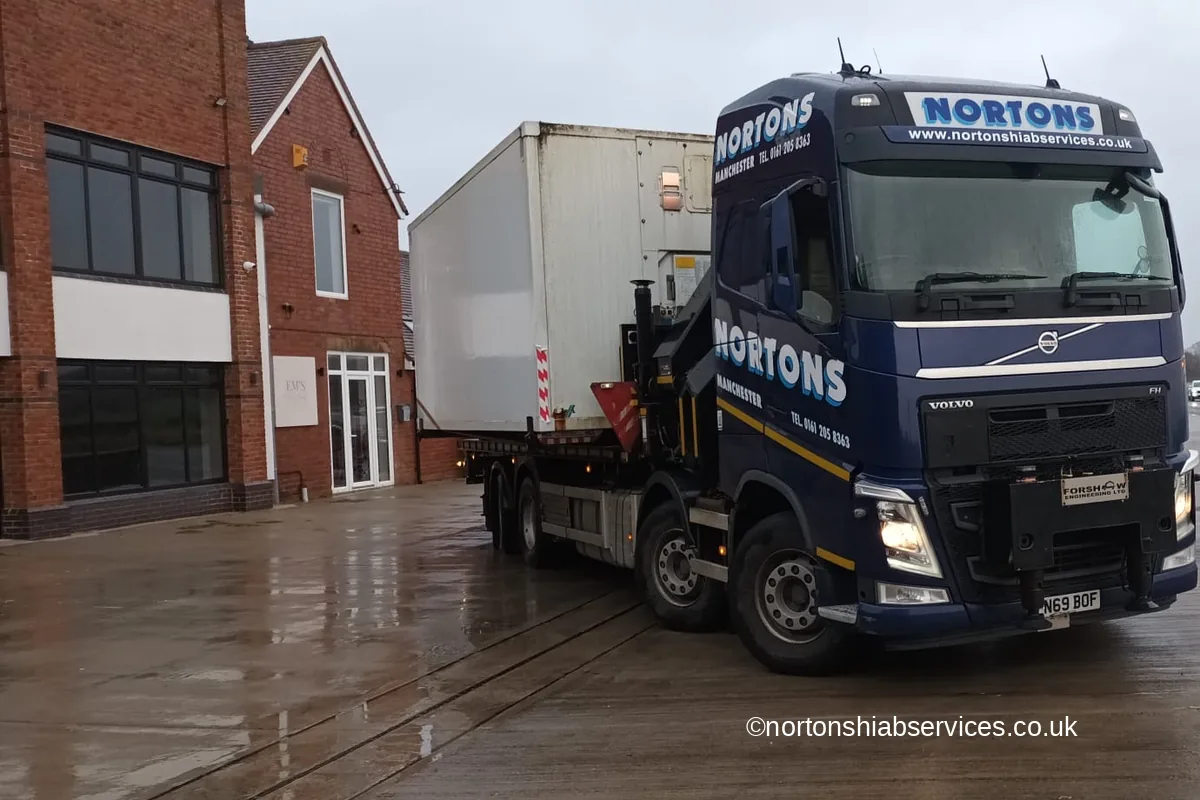Nortons rigid hiab loaded with an oversized twenty by fourteen foot freezer container