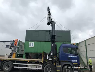 2020 Portfolio Nortons Hiab Services delivering a 32ftx10 anti vandal cabin that our Nortons Cabins team refurbished to specifications. Upon delivery our Hiab and team carried out a triple stack site setup by lifting the cabin on to their two originals units.